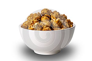 Roasted almond coated with caramel in white ceramic bowl