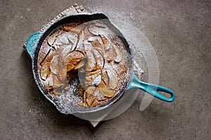 Roasted apple clafoutis (French custard cake) in cast iron pan