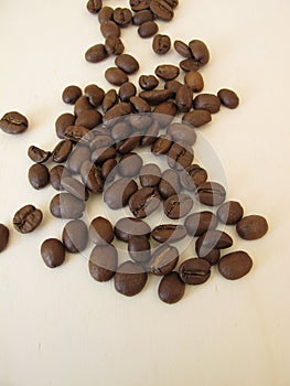 Roasted Arabian coffee beans on a wooden board