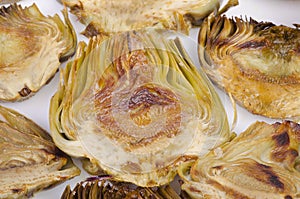 Roasted artichoke on a white