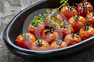 Roasted Balsamic Cherry Tomatoes in Black Dish with Thyme