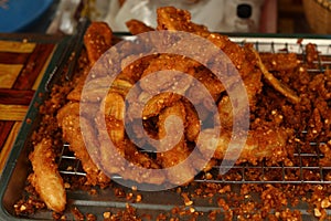 Roasted bananas on grill grate grilled on street food cart