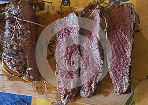 Roasted beef steak slices on cuting board