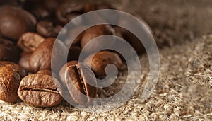 Roasted Black coffee beans on Burlap Sack background. Aroma ingredients. close up. coffee