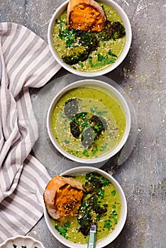 Roasted broccoli soup with melted cheddar croutons.style hugge.selective focus