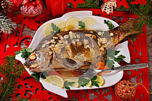 Roasted carp stuffed with vegetables for christmas