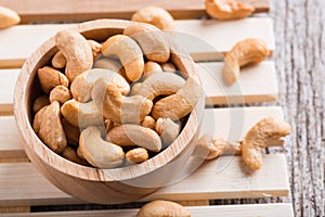 Roasted cashew nuts on rustic wood