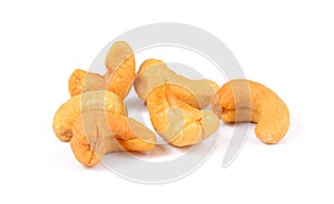 Roasted cashew nuts whith salt on white background