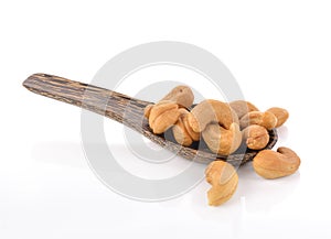 Roasted cashew nuts whith salt on white background.