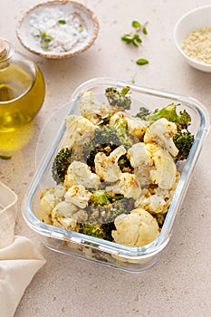Roasted cauliflower and broccoli in a meal prep container, healthy vegetable side dish