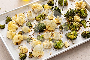 Roasted cauliflower and broccoli on a sheet pan, healthy vegetable side dish