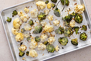 Roasted cauliflower and broccoli on a sheet pan, healthy vegetable side dish