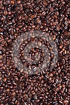 Roasted Ccoffee beans background. Arabic roasting coffee. Ingredient of hot beverage
