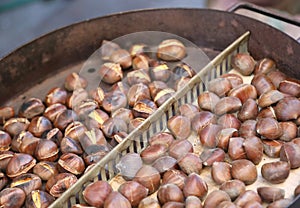 roasted chestnuts cooked on the pot on the street ideal as autumn street food