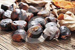 Roasted chestnuts on a rustic wooden table