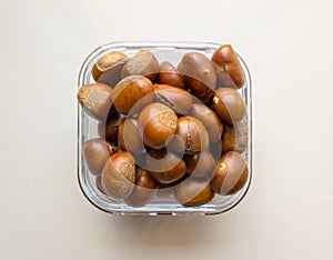 Roasted chestnuts served in a glass dish