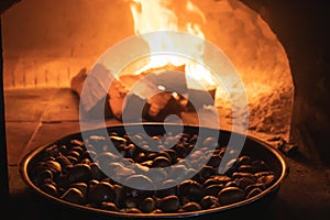 Roasted chestnuts in a wood-burning oven