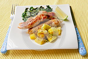 Roasted chicken breast with saute kale and squash vegetables