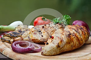 Roasted chicken breast and various vegetables