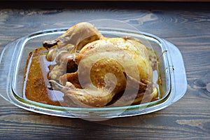 Roasted chicken with a crunching crack on a table