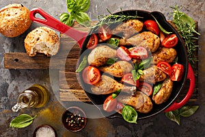 Roasted chicken drumsticks in a cast iron pan