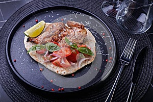 Roasted Chicken on Flatbread With Tomato Salad, Lime Wedge