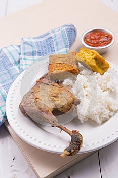 Roasted chicken with fried tofu, tempeh, chilli sauce, and white rice