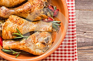 Roasted chicken legs with rosemary, garlic and red chili pepper