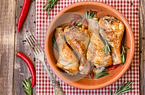 Roasted chicken legs with rosemary, garlic and red chili pepper