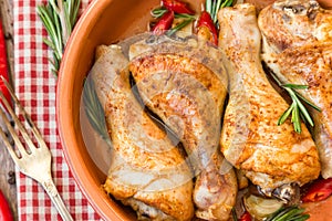 Roasted chicken legs with rosemary, garlic and red chili pepper