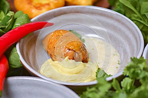 Roasted chicken with mashes potatoes served in a bowl with fresh organic greenery - dill, spinach, parsley.