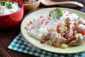 Roasted chicken meat with stalk celery, roasted walnuts and rice