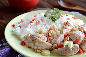 Roasted chicken meat with stalk celery, roasted walnuts and rice