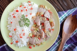 Roasted chicken meat with stalk celery, roasted walnuts and rice