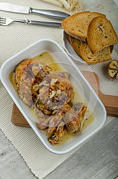 Roasted chicken parts with bio garlic, herb-garlic toast