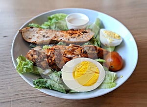 Roasted chicken salad with eggs photo