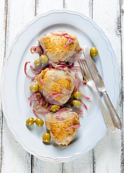 Roasted chicken thighs with olives and red onion