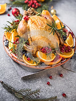 Roasted chicken or  turkey. Traditional festive food for Christmas or Thanksgiving. Christmas Dinner. Winter Holiday table setting