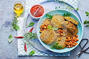 Roasted chickpeas falafel patties with hot spicy sauce