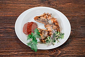 Roasted chiken wings on a plate