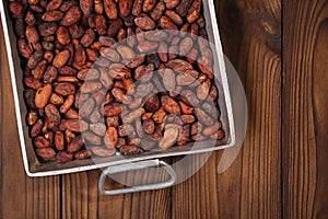 roasted cocoa chocolate beans in Vintage heavy cast aluminum roasting pan
