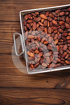 roasted cocoa chocolate beans in Vintage heavy cast aluminum roasting pan