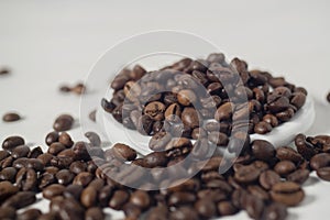 Roasted coffee bean isolated and against white background