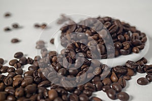 Roasted coffee bean isolated and against white background