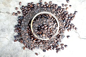 Roasted coffee bean in wooden bowl backgrounds above, Top views