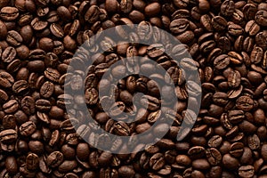 Roasted coffee beans background. Close up top view.