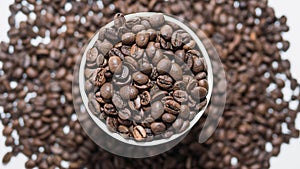 Roasted coffee beans background,coffee glass filled with coffee beans,top view,close-up.