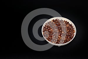 roasted coffee beans in a bowl