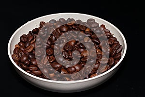 roasted coffee beans in a bowl