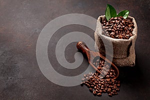 Roasted coffee beans in burlap bag
